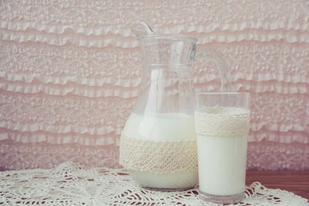 glass jar of milk on a light backgroundの写真素材