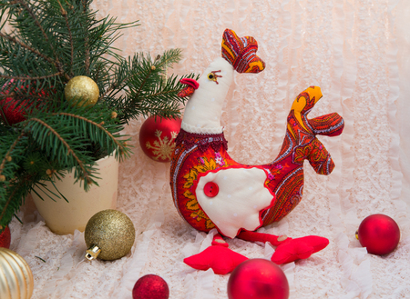 plush, red Christmas cock in the spruce branches, 2017の写真素材