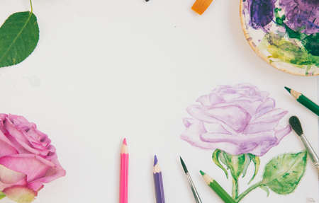 watercolor sketch of a purple rose with brushes and paintsの写真素材