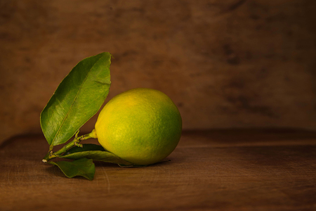 citrus fruit at a shabby wooden backgroundの写真素材