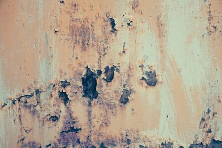 background an old wall with colored spots and stainsの写真素材