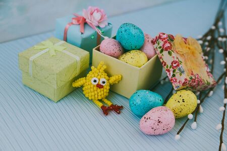 Easter card with blue, pink and yellow eggsの写真素材