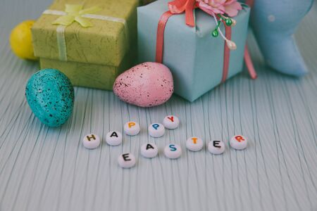 Easter card with blue, pink and yellow eggsの写真素材