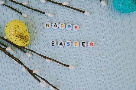 Easter card with blue, pink and yellow eggsの写真素材