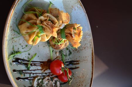 Stuffed pancakes with cherry tomatoes