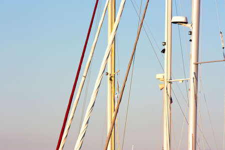 Detail od saillboat masts  and rigging against the blue sky
