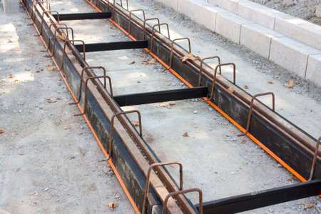 Construction of tramway track with steel rails coating - vibration damping material for noise reduction, in the urban areaの写真素材