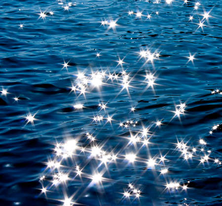 Detail of a  moonlight reflecting in glittering seaの写真素材