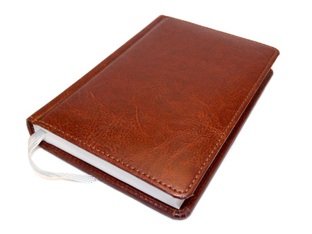 brown notepad isolated on white backgroundの写真素材