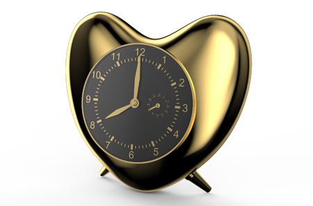 golden clock in the shape of heart  isolated on white backgroundの写真素材