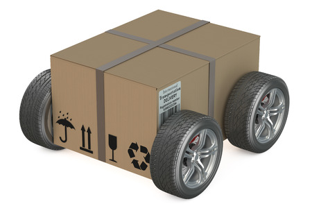 Cardboard box with wheels - shipping concept isolated on white backgroundの写真素材