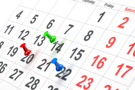 Push pin in calendar isolated on white backgroundの写真素材