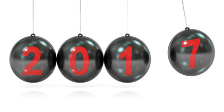 Happy New Year 2017 concept, balancing balls Newton's cradle. 3D rendering isolated on white backgroundの写真素材
