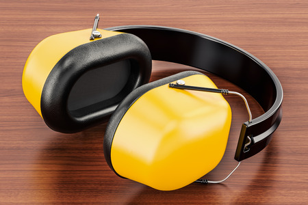 Standard Ear Defenders on the wooden table. 3D rendering の写真素材