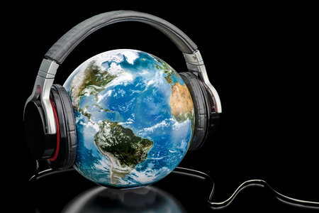 Earth Globe with wireless headphones, world music concept. 3D renderingの写真素材