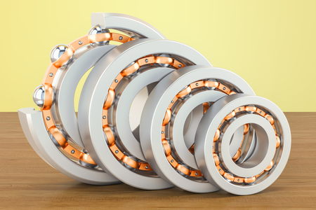 Ball bearings, cutaway on the wooden table. 3D renderingの写真素材