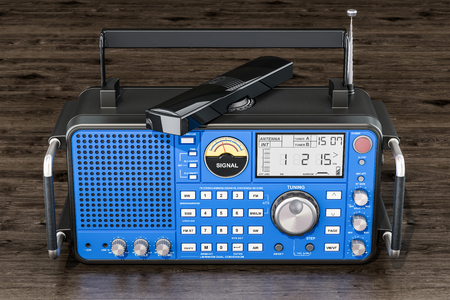 Modern digital radio on the wooden table, 3D renderingの写真素材