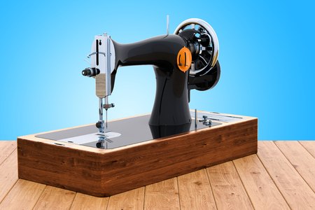 Retro sewing machine on the wooden desk, 3D renderingの写真素材