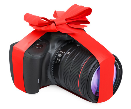 Digital camera with bow and ribbon, gift concept. 3D rendering isolated on white backgroundの写真素材