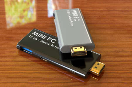 Mini PC TV Dongle Sticks on the wooden table. 3D rendering