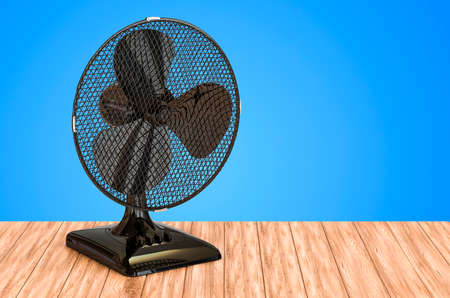 Table Fan on the wooden table. 3D rendering