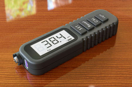 Coating Thickness Gauge on the wooden table, 3D renderingの写真素材
