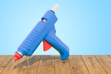Glue Gun on the wooden planks, 3D renderingの写真素材