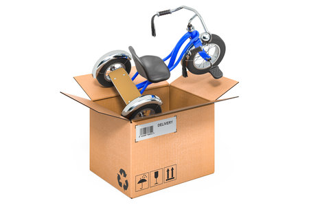 Tricycle kids bicycle inside cardboard box, delivery concept. 3D rendering isolated on white backgroundの写真素材