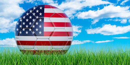 Soccer ball with the United States flag on the green grass against blue sky, 3D renderingの写真素材