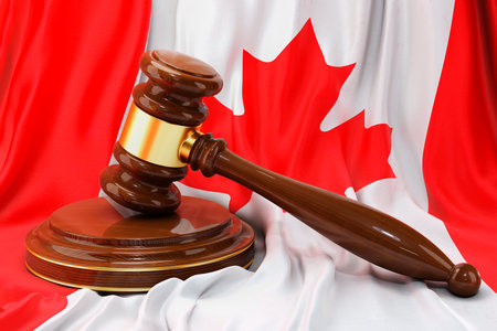 Canadian law and justice concept. Wooden gavel on flag of Canada, 3D renderingの写真素材