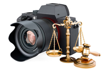 Digital camera with wooden gavel and scales of justice. 3D rendering isolated on white backgroundの写真素材