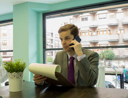 Man sitting at his desk and workingの写真素材