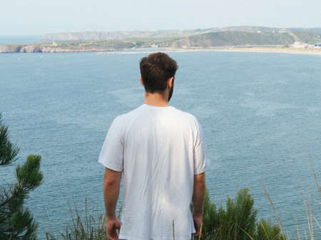 A boy walking alone a pathの写真素材