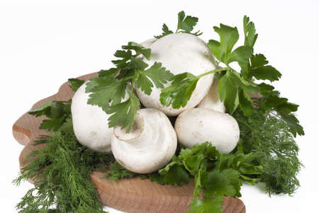 mushrooms with herbs on a kitchen boardの写真素材