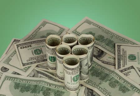 Triangle of dollars to the background notesの写真素材
