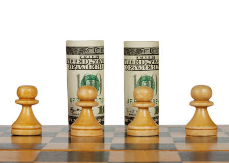 Dollars on the chess board isolated on whiteの写真素材