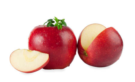 Bright red apple with a slice isolated on white backgroundの写真素材