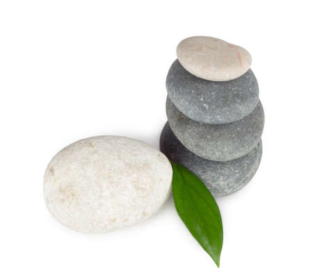 Boat round stones with leaf isolated on white background の写真素材