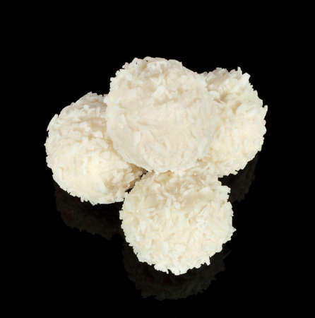 White sweet candy stacked pyramid on a black backgroundの写真素材