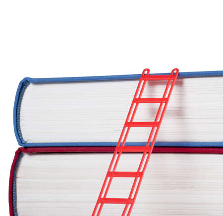 Books with a red ladder isolated on white backgroundの写真素材