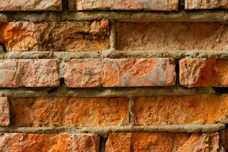 The old red brick wall with cracksの写真素材