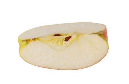 A piece of juicy apple and stone isolated on a white backgroundの写真素材