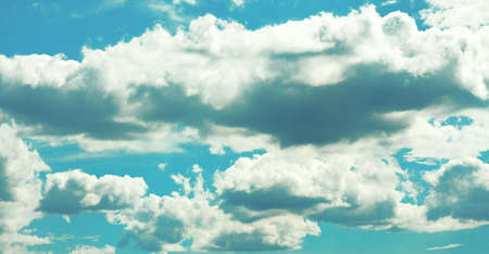 Flying the heavy clouds in the blue skyの写真素材