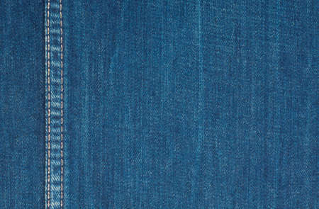 Background of rough denim fabric with vertical seamの写真素材