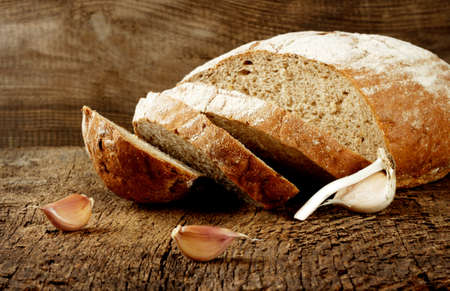 Black bread with garlic on a wooden backgroundの写真素材