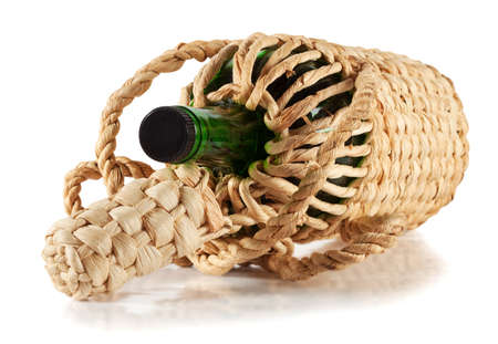 Green empty bottle in the braid isolated on white backgroundの写真素材