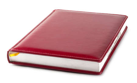 Red diary with bookmark isolated on white backgroundの写真素材