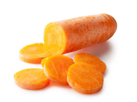 Chopped carrot slices isolated on white backgroundの写真素材