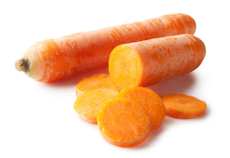 Bright carrot and slices isolated on white backgroundの写真素材