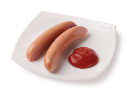 Raw sausages on a plate isolated on white backgroundの写真素材